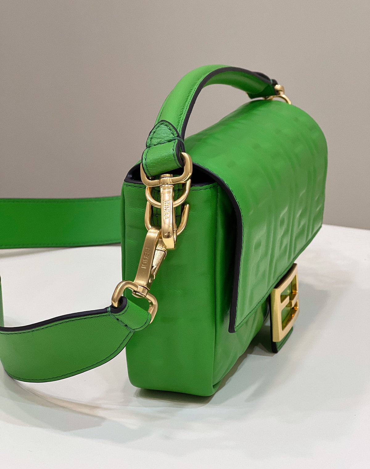 BAGUETTE WITH FF MOTIF 27 IN EMERALD GREEN SOFT LAMBSKIN GOLD HARDWARE
