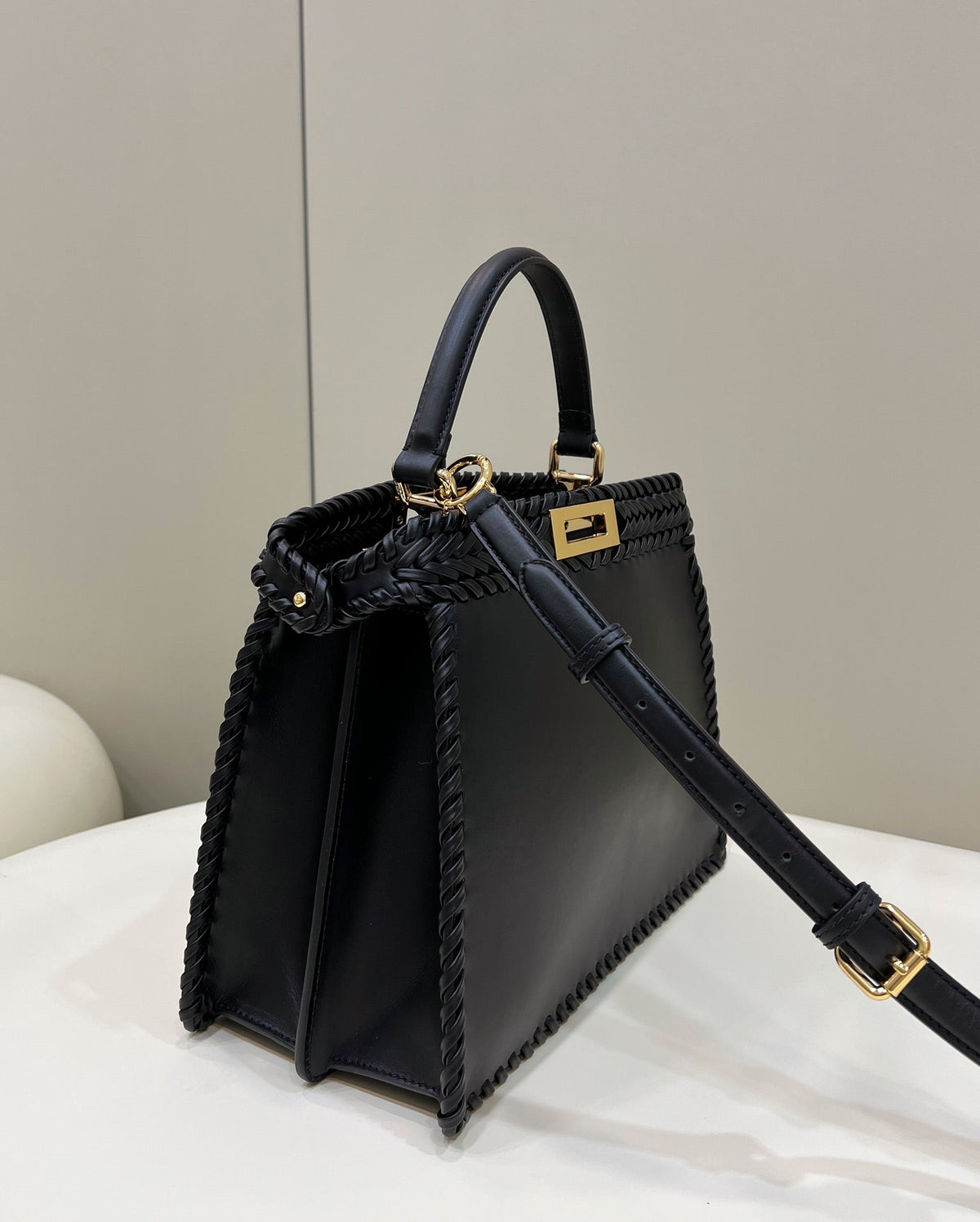 PEEKABOO ISEEU 27 IN BLACK SMOOTH CALFSKIN WITH WOVEN TRIM GOLD HARDWARE