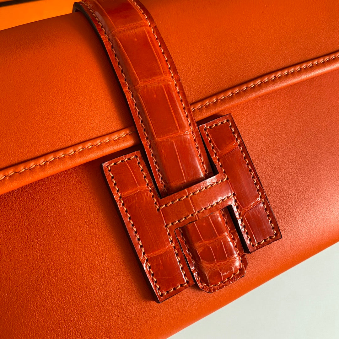 JIGE ELAN 29 CLUTCH IN BRIGHT ORANGE CALFSKIN WITH LIZARD SKIN