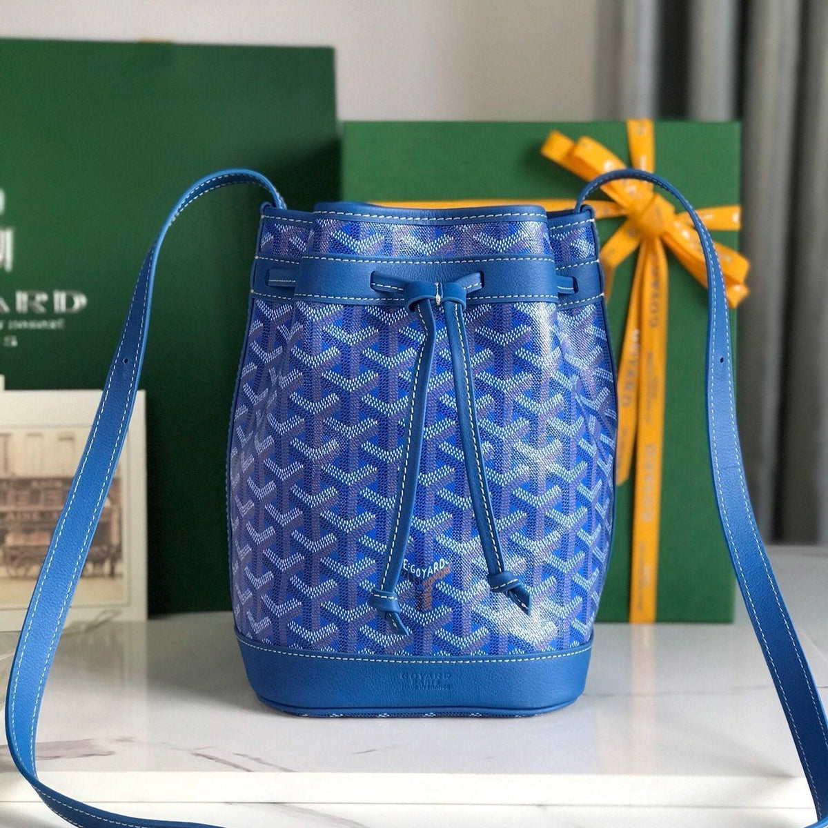 PETIT FLOT BUCKET BAG 22 IN SAPPHIRE BLUE GOYARDINE CANVAS AND LAMBSKIN TRIM