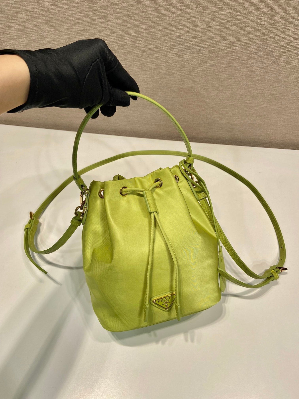 BUCKET BAG 19 IN APPLE GREEN RE-NYLON AND SAFFIANO LEATHER HANDLE