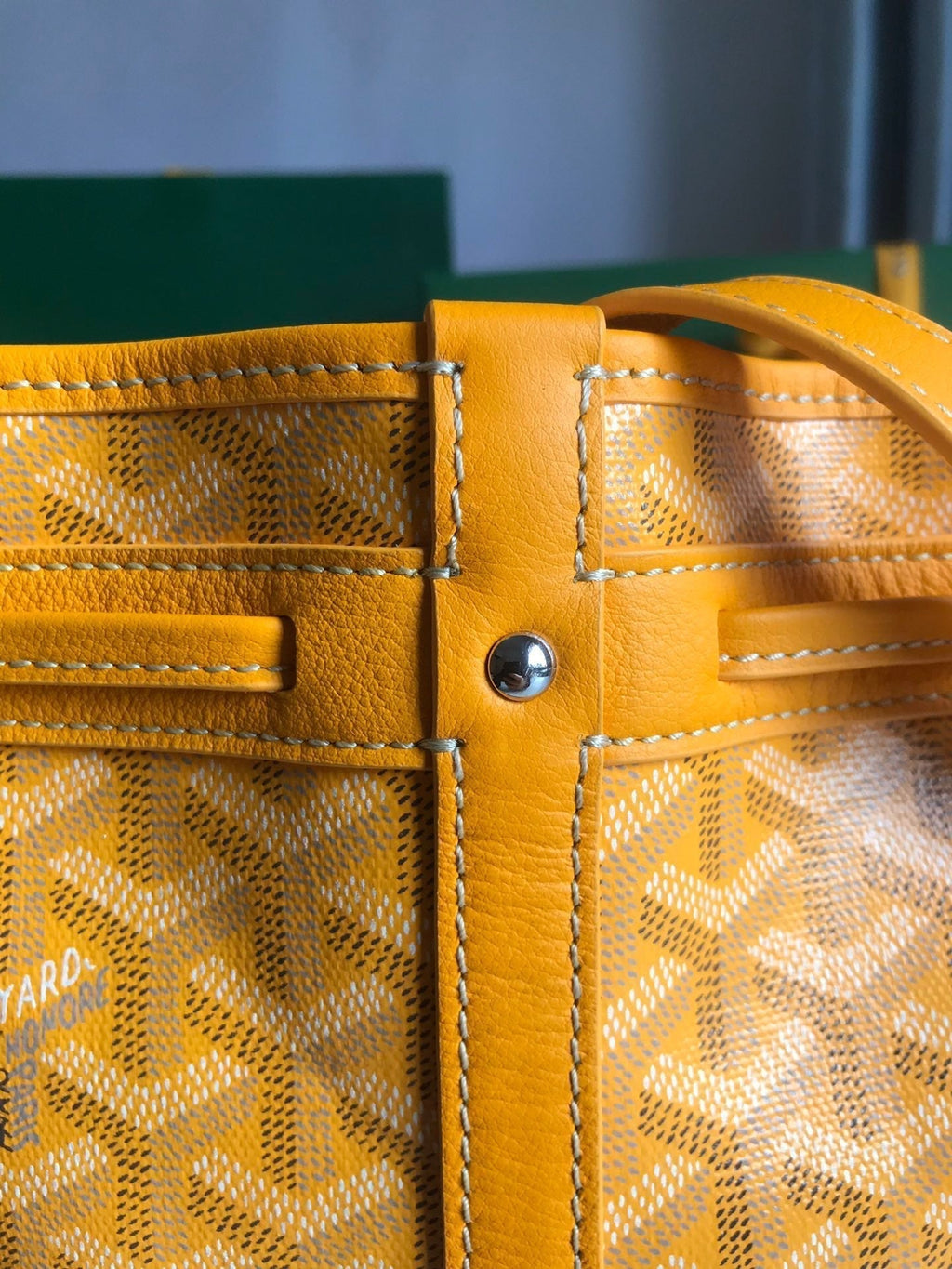 PETIT FLOT BUCKET BAG 22 IN YELLOW GOYARDINE CANVAS AND LAMBSKIN TRIM