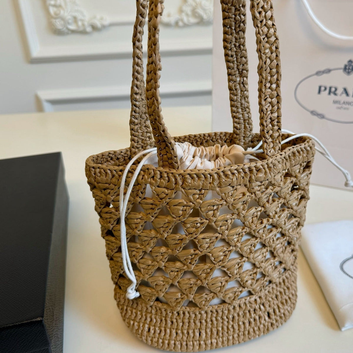 CROCHET BUCKET BAG 32 IN BROWN WOVEN RAFFIA EMBROIDED LOGO