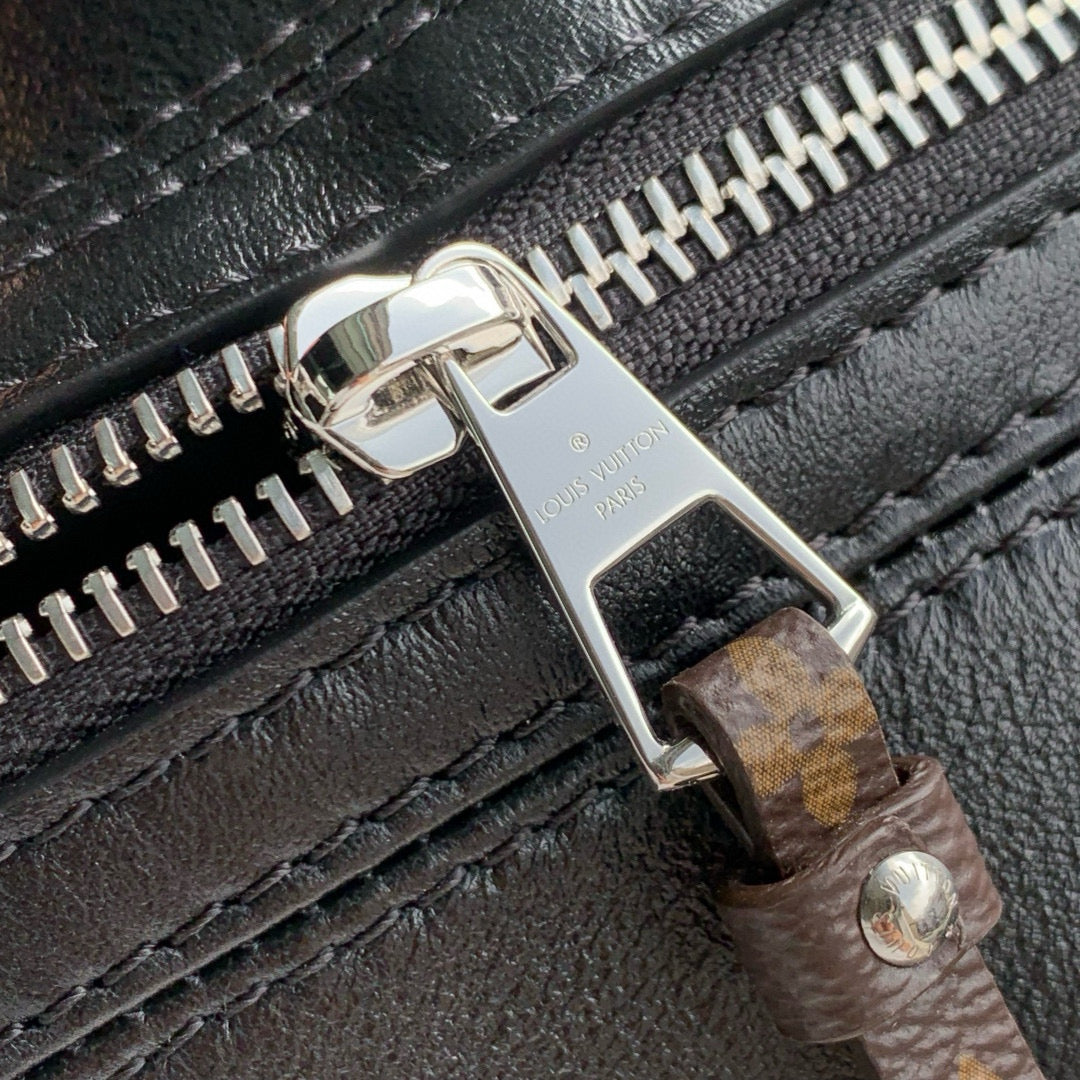 POCHETTE VIBE HANDBAG 25 IN BLACK LAMBSKIN BROWN COWHIDE AND COATED CANVAS TRIM