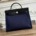 ZIP CABINE 31 BAG IN NAVY BLUE CANVAS AND BLACK CALFSKIN