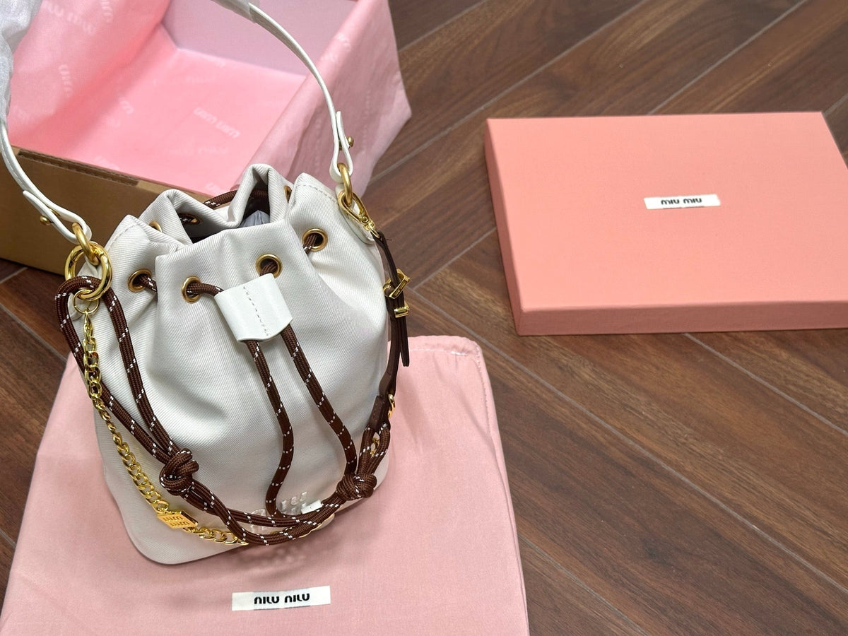 DRAWSTRING BUCKET BAG 21 IN WHITE CANVAS GOLD HARDWARE